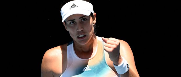 Tennis - Australian Open - Melbourne Park, Melbourne, Australia - January 18, 2022 Spain's Garbine Muguruza reacts during her first round match against France's Clara Burel REUTERS/Morgan Sette