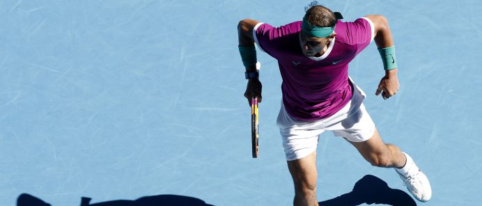 MELBOURNE, AUSTRALIA - JANUARY 19: Rafael Nadal of Spain reacts in his second round singles match against Yannick Hanfmann of Germany during day three of the 2022 Australian Open at Melbourne Park on January 19, 2022 in Melbourne, Australia. (Photo by Darrian Traynor/Getty Images)