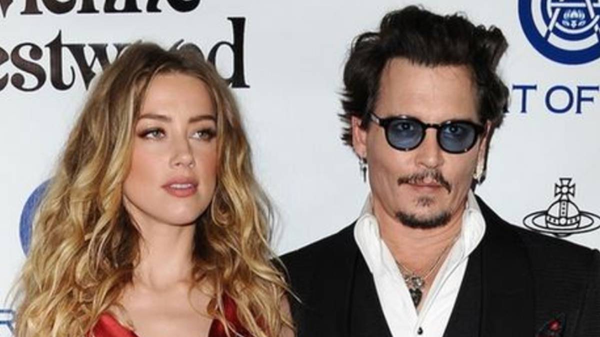 Los actores Amber Heard y Johnny Deep posando juntos en un photocall cuando eran pareja. Foto Facebook