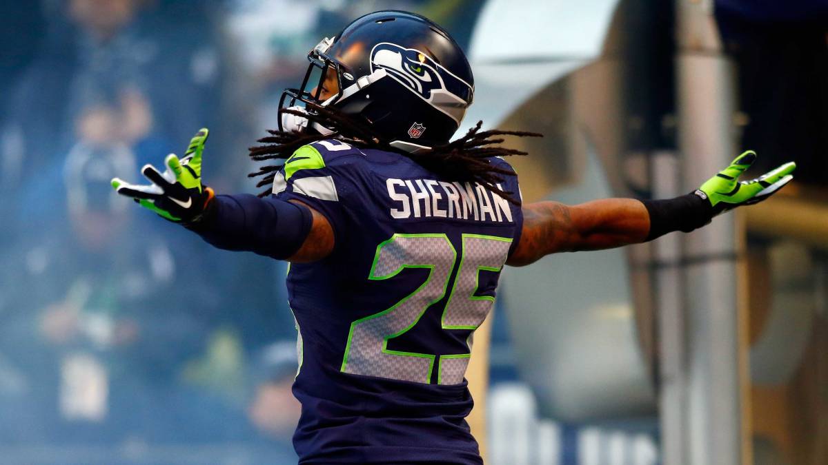 Richard Sherman llega a un acuerdo con los 49ers por 3 años -Richard Sherman estirando los brazos