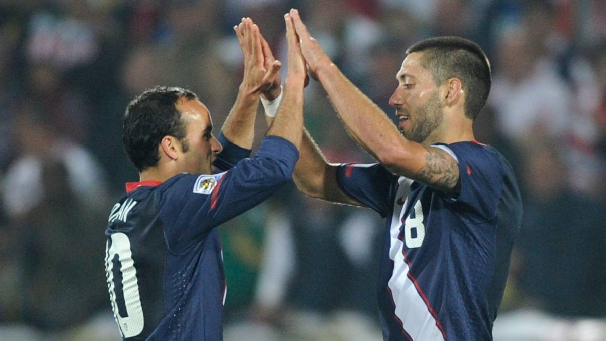 Clint Dempsey (R) and Landon Donovan of the United States celebrate at the final whistle during the 2010 FIFA World Cup South Africa Group C match between England and USA at the Royal Bafokeng Stadium on June 12, 2010 in Rustenburg, South Africa