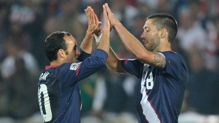 Clint Dempsey (R) and Landon Donovan of the United States celebrate at the final whistle during the 2010 FIFA World Cup South Africa Group C match between England and USA at the Royal Bafokeng Stadium on June 12, 2010 in Rustenburg, South Africa