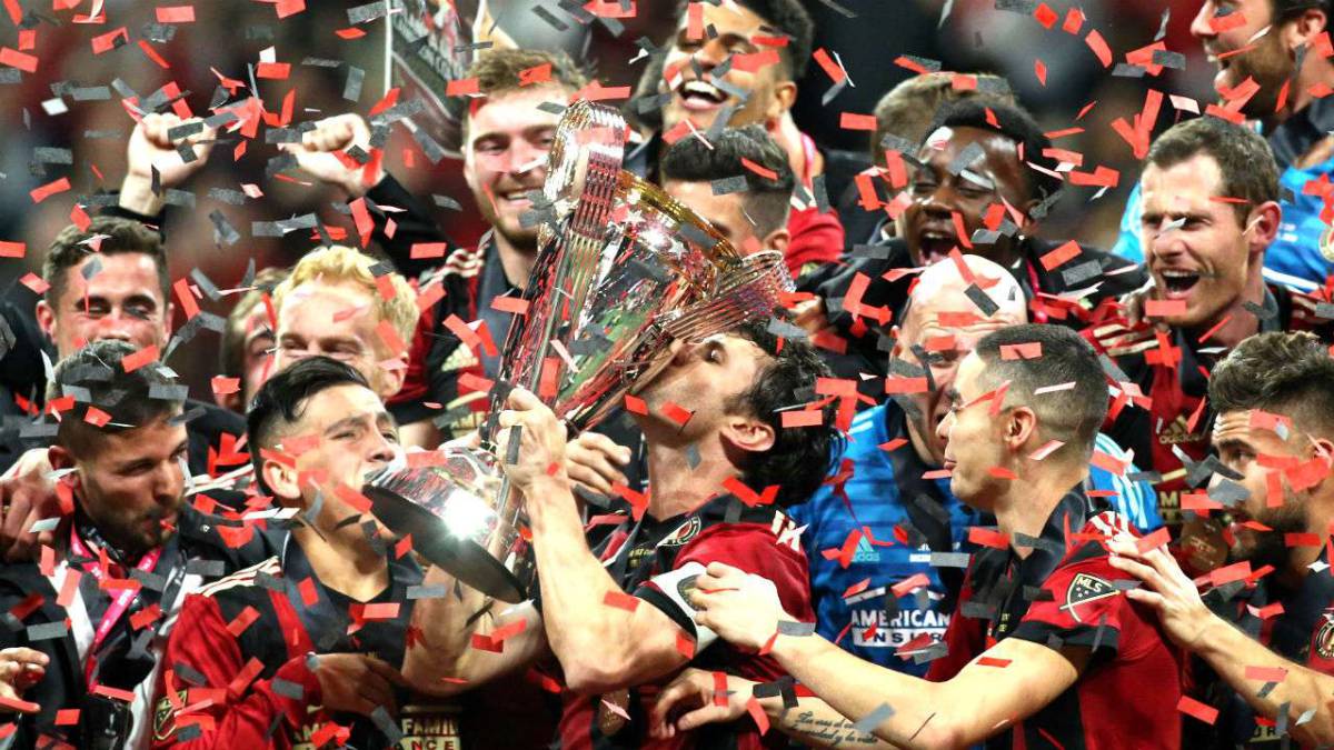Atlanta United's Michael Parkhurst celebrates with teammates after defeating the Portland Timbers in the 2018 MLS Cup championship game at Mercedes-Benz Stadium