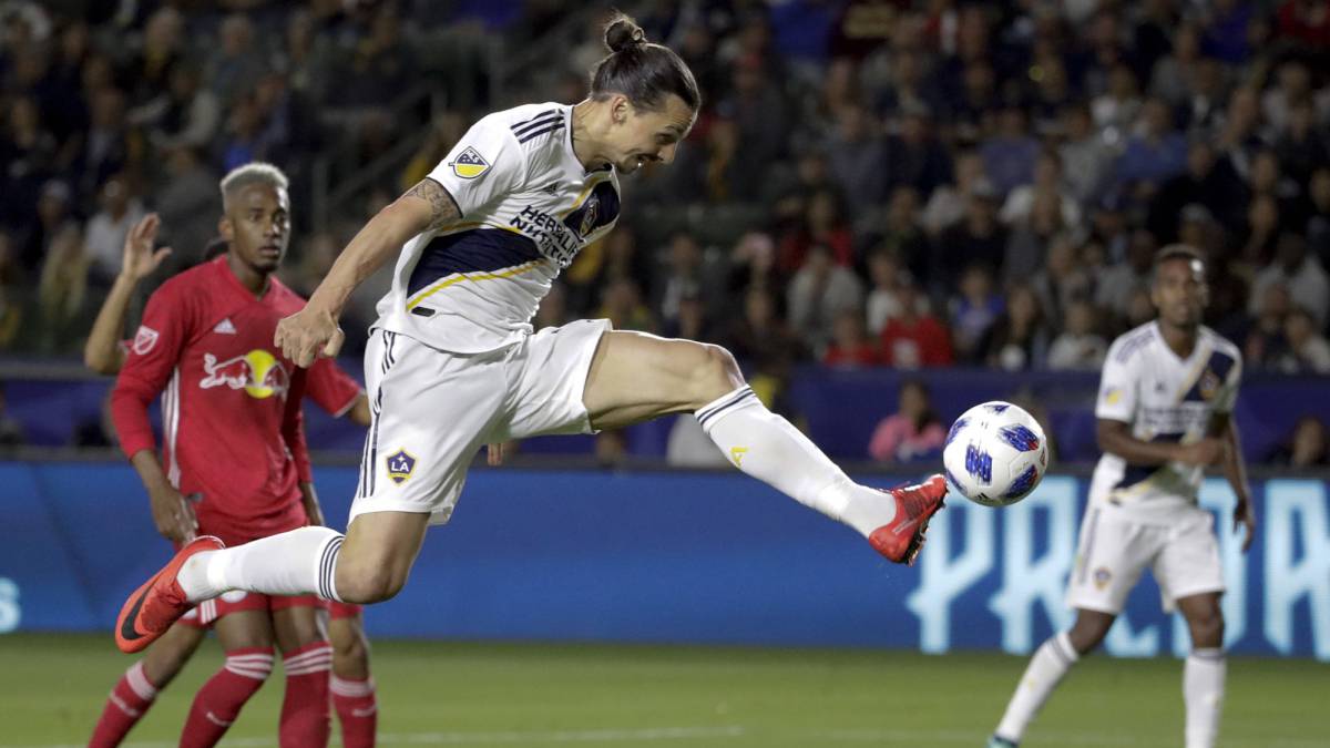 LA Galaxy forward Zlatan Ibrahimovic kicks the ball into the goal during the second half of an MLS soccer match against the New York Red Bulls,