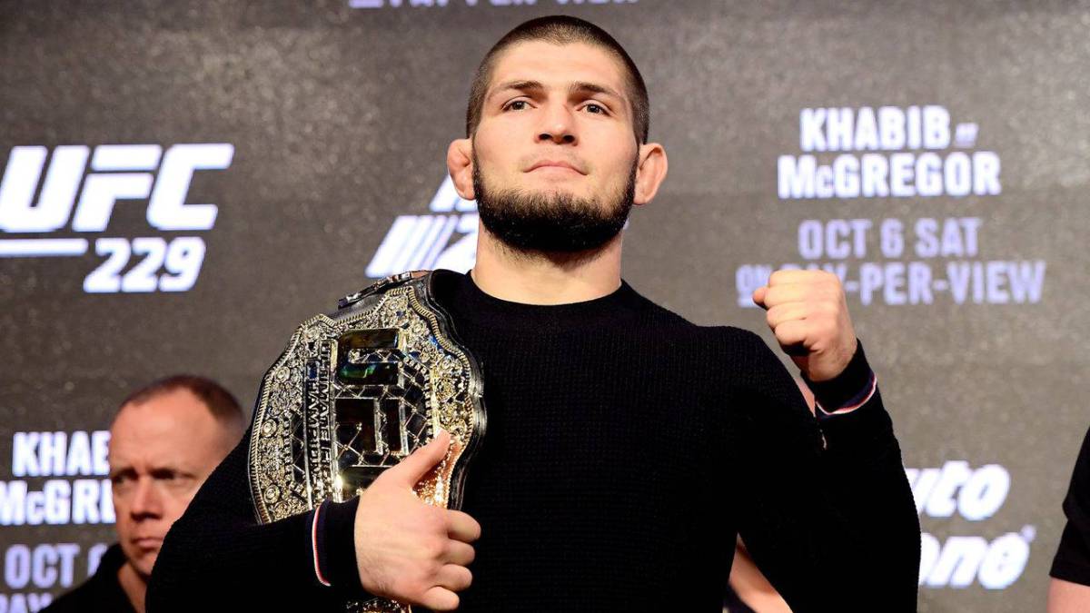 Khabib Nurmagomedov show casing his UFC champion belt