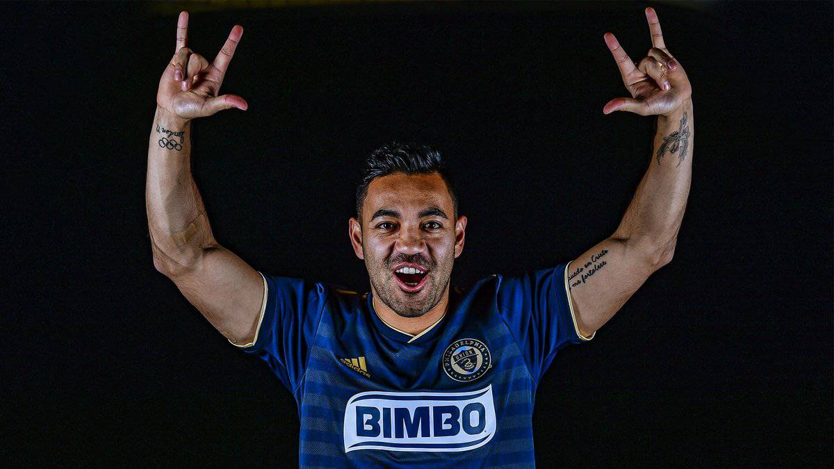 Marco Fabián possing with his new shirt from Philadelphia Union