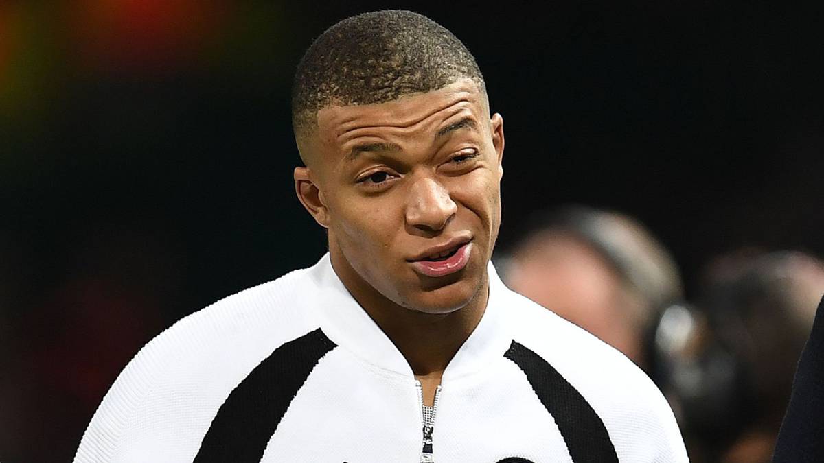 Paris Saint-Germain's French striker Kylian Mbappe leaves the pitch after the first leg of the UEFA Champions League round of 16 football match between Manchester United and Paris Saint-Germain