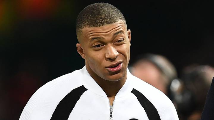 Paris Saint-Germain's French striker Kylian Mbappe leaves the pitch after the first leg of the UEFA Champions League round of 16 football match between Manchester United and Paris Saint-Germain