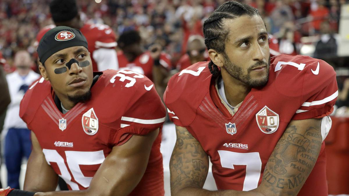 San Francisco 49ers safety Eric Reid and quarterback Colin Kaepernick kneel during the national anthem before an NFL football game against the Los Angeles Rams