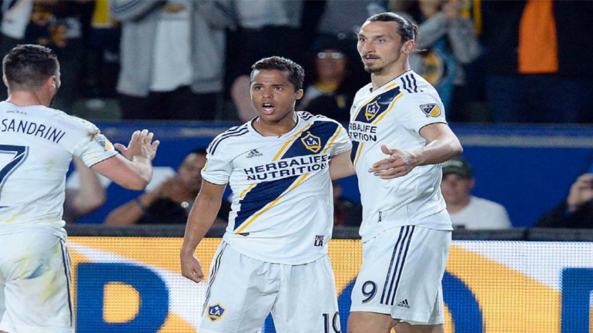 Zlatan Ibrahimovic and Giovani dos Santos celebrating after their team LA Galaxy scored during an MLS game