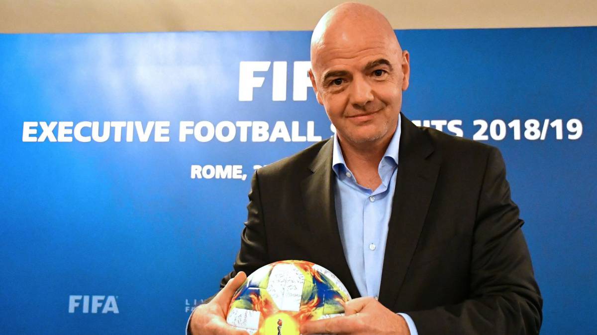 FIFA President Gianni Infantino poses with the official ball of the 2019 Women's World Cup during a press conference at the end of the FIFA Executive Football Summit in Rome on February 27, 2019.