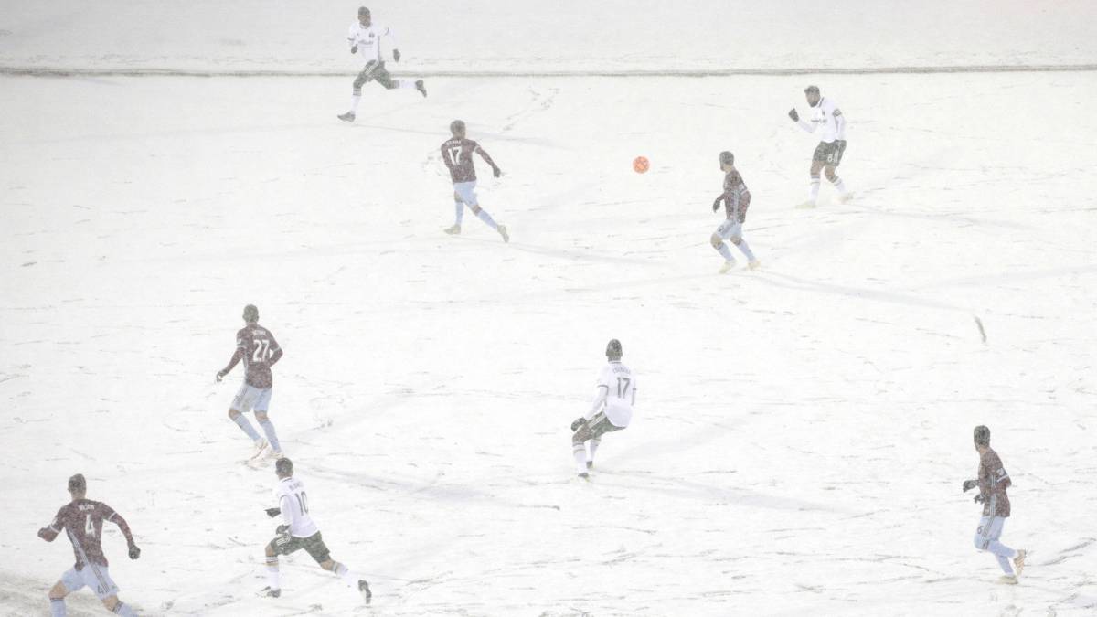 The Colorado Rapids play the Portland Timbers on a snow-covered pitch during the second half of an MLS soccer game