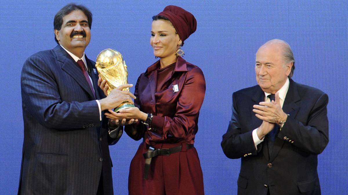 Picture taken on December 2, 2010 shows the Emir of the State of Qatar Sheikh Hamad bin Khalifa Al-Thani and his wife Sheikha Moza bint Nasser Al-Missned receiving the World Cup trophy from Fifa President Joseph Blatter