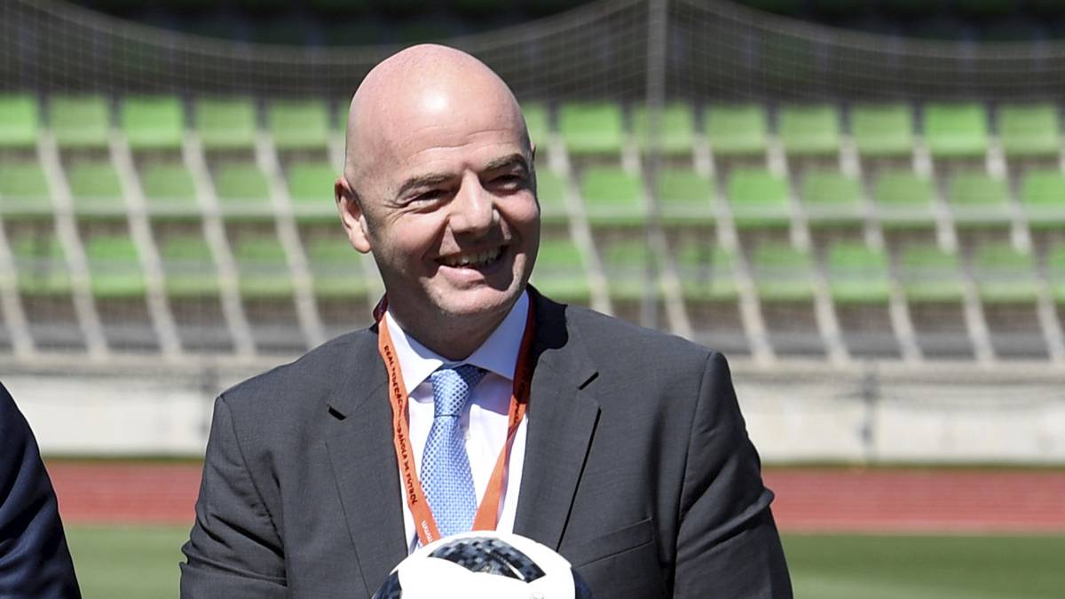 FIFA President Gianni Infantino poses in the field