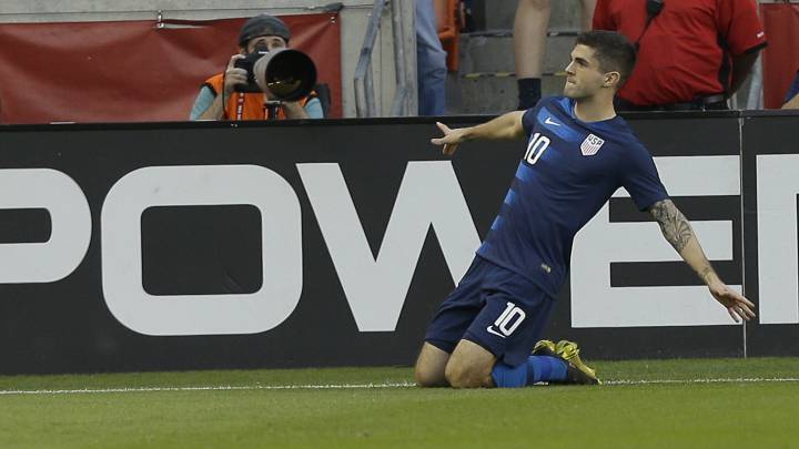 Christian Pulisic #10 of the USA celebrates after scoring during the first half against Chile