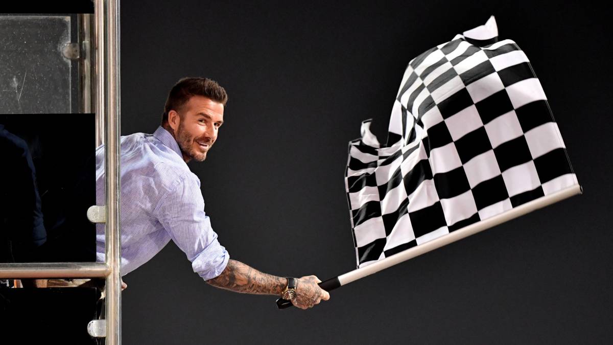 David Beckham waves the chequered flag at the end of the race