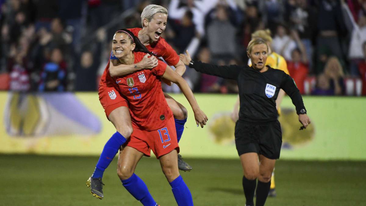 Alex Morgan #13 of the United States celebrates with Megan Rapinoe #15 after scoring her 100th international goal against Australia at Dick's Sporting Goods Park