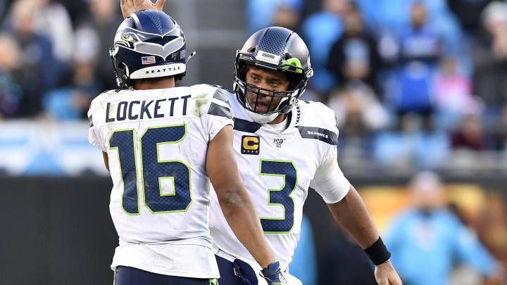 Tyler Lockett con Russell Wilson