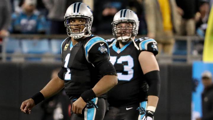 Cam Newton y Greg Van Roten