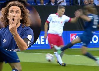 Have a word ref! Puyol goes in high on Phil Neville