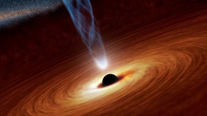 Hallan un "legendario agujero negro de masa intermedia" con una lente gravitacional