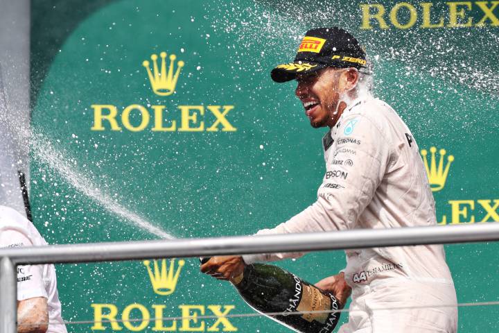 Hamilton coasts to victory to widen gap over Rosberg