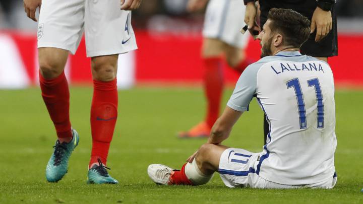 England's Adam Lallana lies injured
