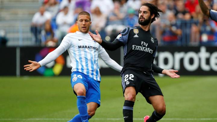 Real Madrid’s Isco in action with Malaga's Keko