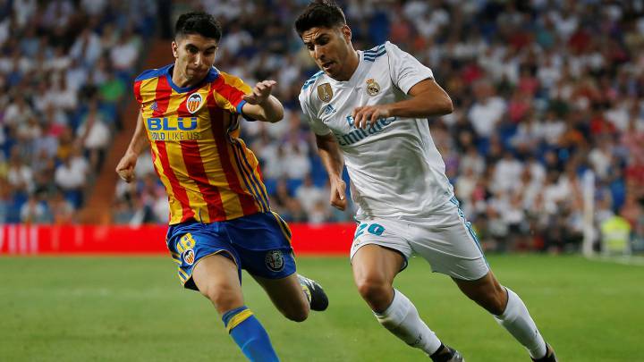 Marco Asensio provided two excellent left-footed strikes to rescue a point for Real Madrid against Valencia, who saw Carlos Soler and Geoffrey Kondogbia score.
