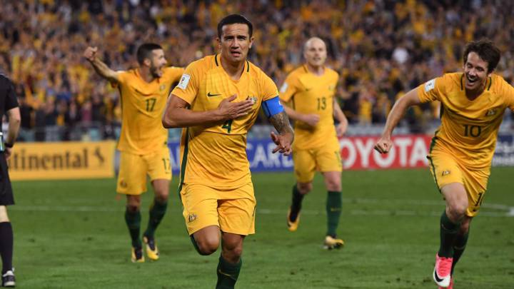 Tim Cahill of Australia (2/L) celebrates with teammates after scoring against Syria 
