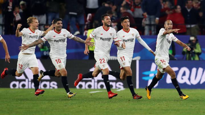 Sevilla’s Guido Pizarro celebrates scoring their third goal with Ever Banega, Franco Vazquez, Joaquin Correa and team mates.