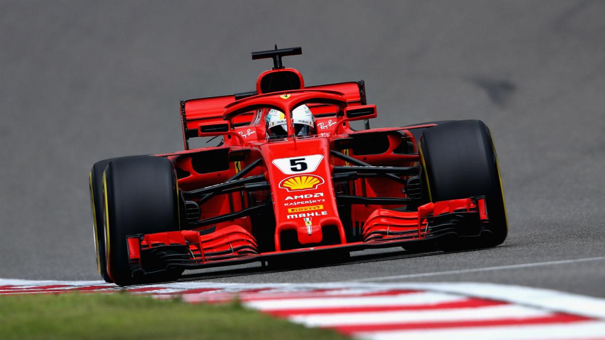 Vettel snatches pole from Raikkonen as Ferrari dominate in Shanghai