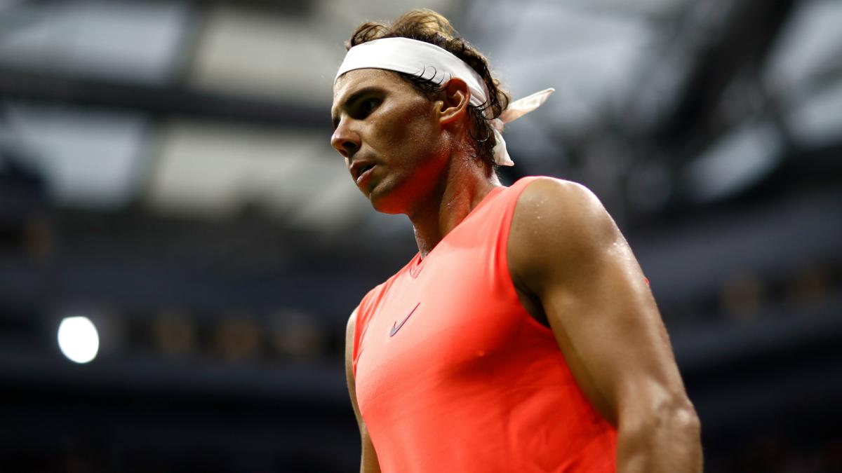 rafa nadal tight-lipped over knee injury scare