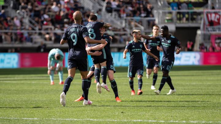 NYC FC players celebrating after Mitrita opens the score against DC United