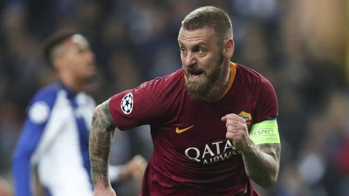 Roma midfielder Daniele De Rossi celebrates after scoring his side's first goal during the Champions League round of 16