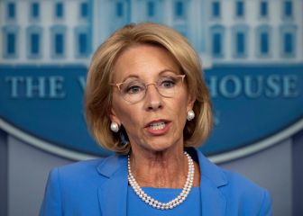 Why has Betsy DeVos submitted her resignation?