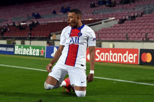 Kylian Mbappé of Paris Saint-Germain celebrates after scoring their side's first goal during the UEFA Champions League Round of 16 match against FC Barcelona.