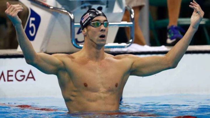 When did Michael Phelps retire? How many medals did he win?