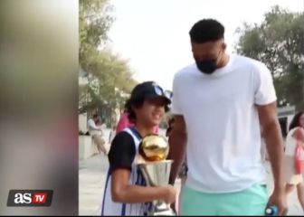 Giannis walks around with his trophy in Greece