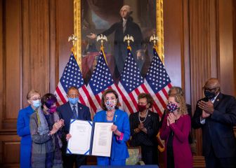 What does the stopgap spending bill signed by Biden include?