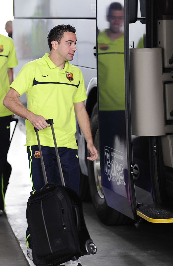 Xavi y Piqué hacen horas extras para llegar a Sevilla