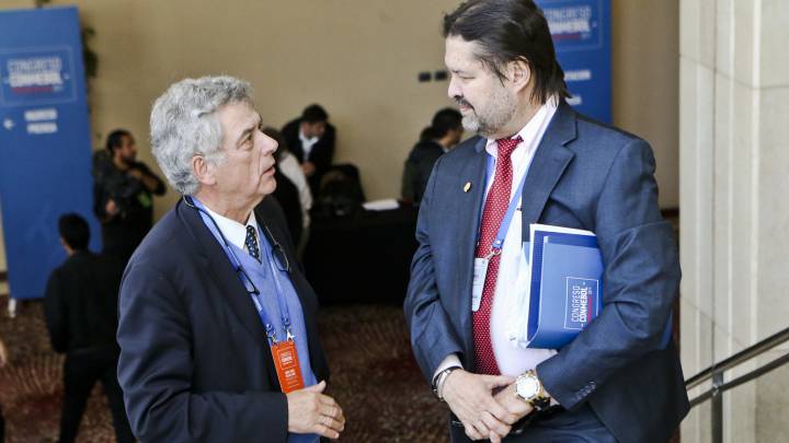 Spanish Football Federation president Angel Maria Villar, left, talks with a member of the South American Football Confederation, CONMEBOL, during the CONMEBOL congress in Santiago, Chile, Wednesday, April 26, 2017.