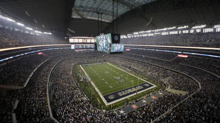 In this Sept. 8, 2013, file photo, fans watch at the start of an NFL football game between the New York Giants and Dallas Cowboys, in Arlington, Texas. The owboys are worth $4.2 billion, making them the most valuable sports franchise for the second straight year, according to Forbes.