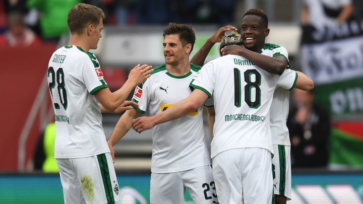 (L-R) Moenchengladbach's defender Matthias Ginter, Moenchengladbach's midfielder Jonas Hofmann, Moenchengladbach's Swiss striker Josip Drmic and Moenchengladbach's Swiss midfielder Denis Zakaria react after the fourth goal for their team during the German first division Bundesliga football match  1. FC Nuremberg vs Borussia Moenchengaldbach in the stadium in Nuremberg, southern Germany, on May 11, 2019. (Photo by Christof STACHE / AFP) / DFL REGULATIONS PROHIBIT ANY USE OF PHOTOGRAPHS AS IMAGE SEQUENCES AND/OR QUASI-VIDEO