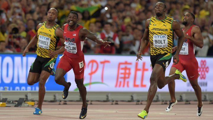Usain Bolt , Justin Gatlin, Asafa Powell y Tyson Gay compiten en la final de los 100 metros lisos de los Mundiales de Atletismo de Pekín 2015.