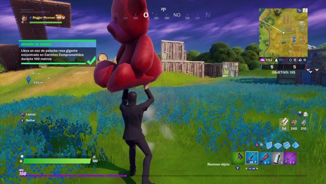 fortnite capitulo 2 temporada 2 desafios mision de midas desafio lleva un oso de peluche rosa gigante encontrado en carretes comprometidos durante 100 metros