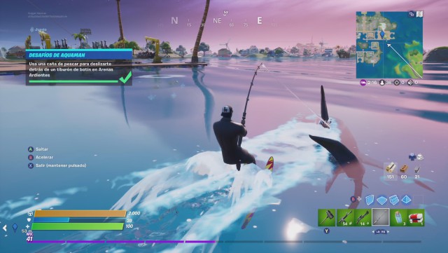fortnite capitulo 2 temporada 3 desafios aquaman desafio usa una caña de pescar para deslizarte detras de un tiburon de botin en arenas ardientes