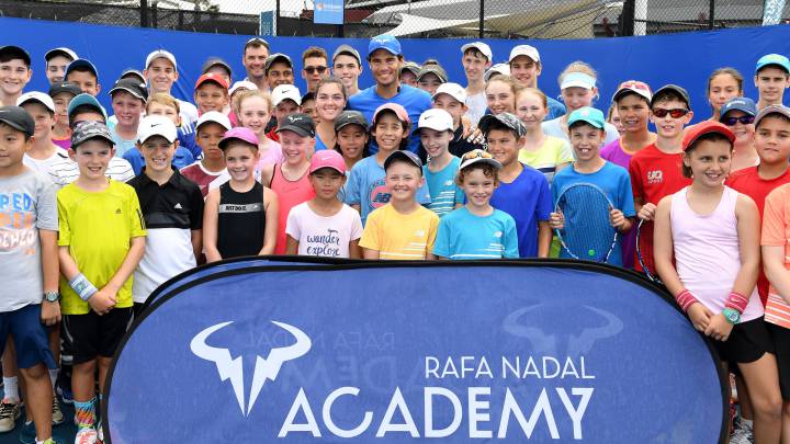 Rafael Nadal poses with young tennis players chosen for his Rafa Nadal Tennis Academy