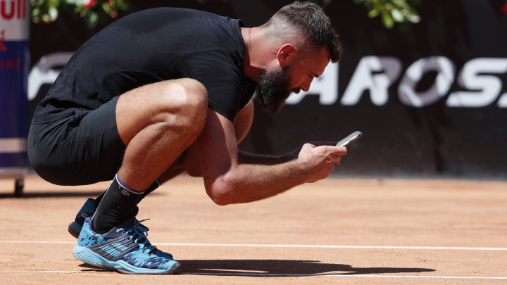 Benoit Paire snaps a shot at the mark of a ball on the court during his match against Stefano Travaglia at the 1000 Masters in Rome.