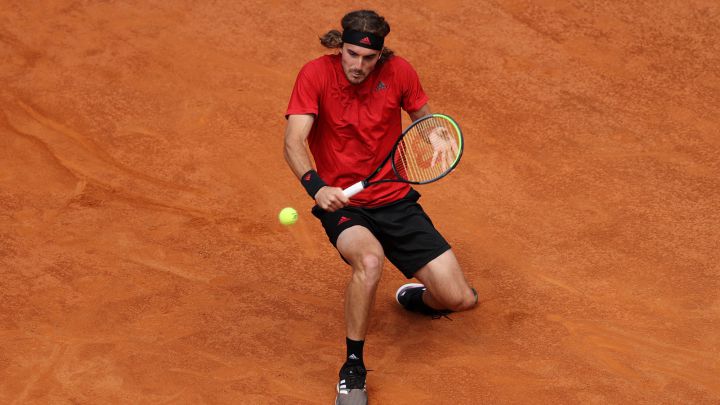 Stefanos Tsitsipas returns a ball during his match against Novak Djokovic at the 1000 Masters in Rome.
